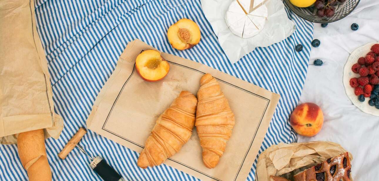 Assorted Fruits and Breads on Picnic Blanket